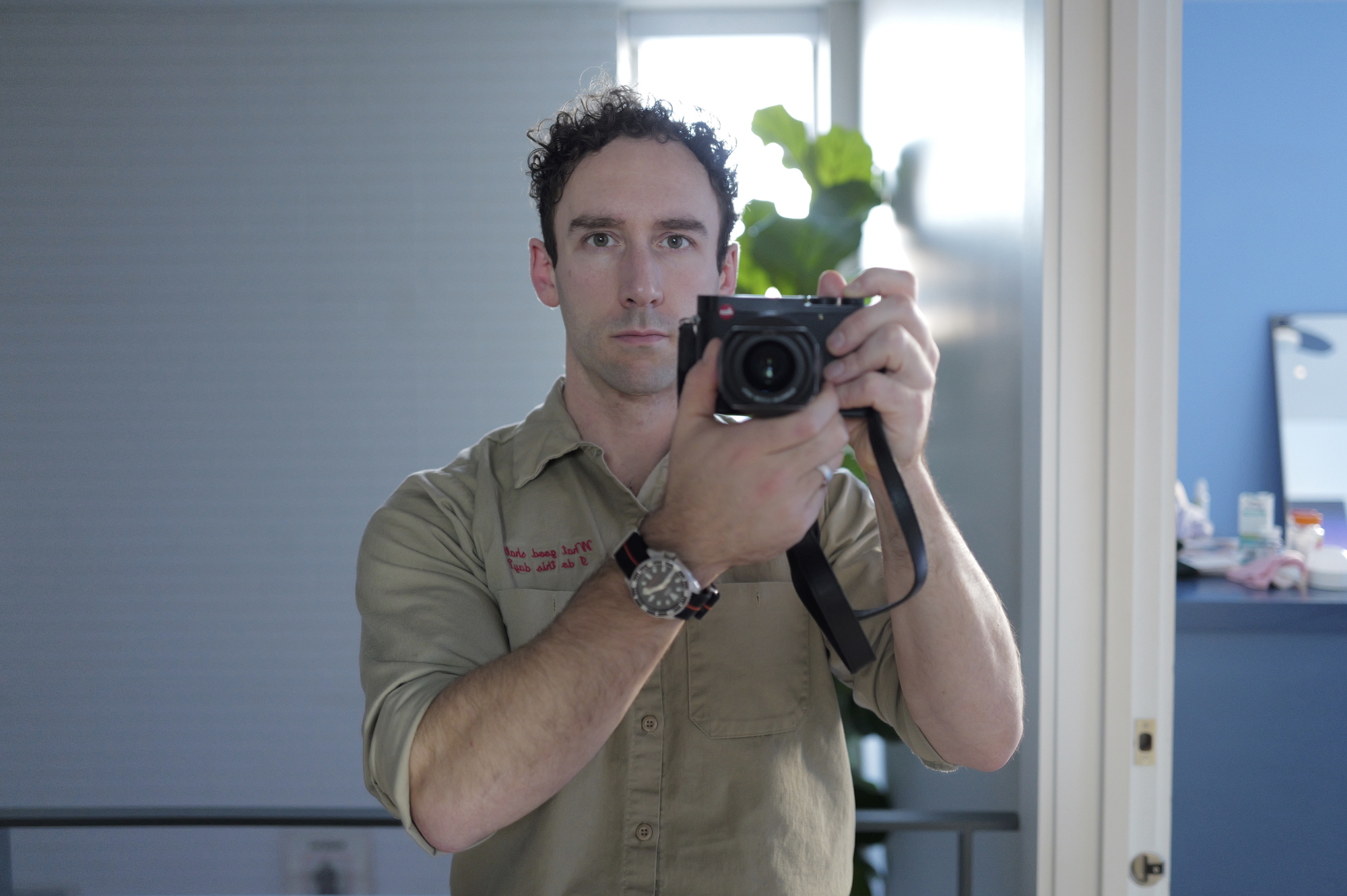 Me holding the rented Leica Q3 for a test shot