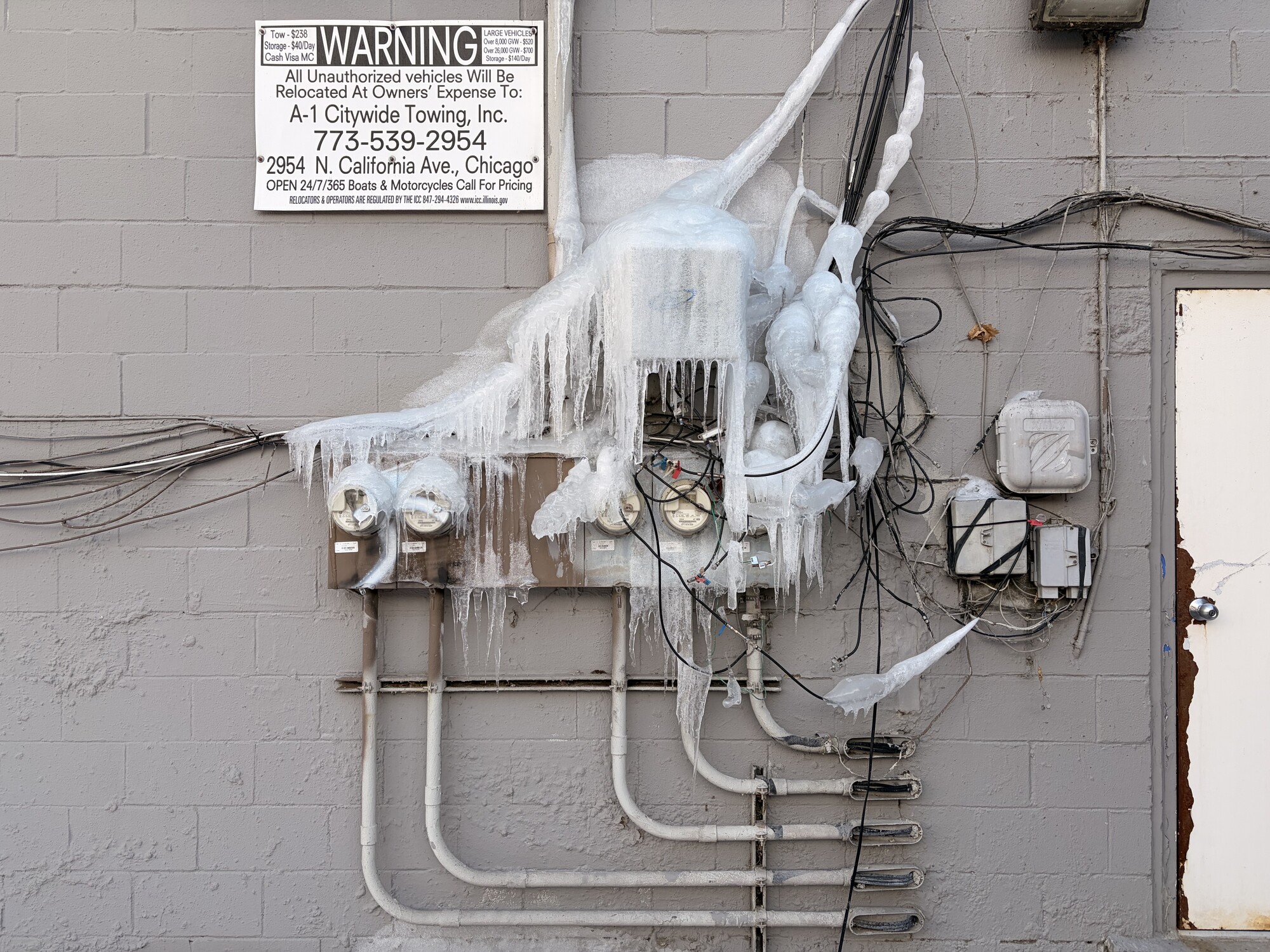 Ice frozen over electrical meters on a building