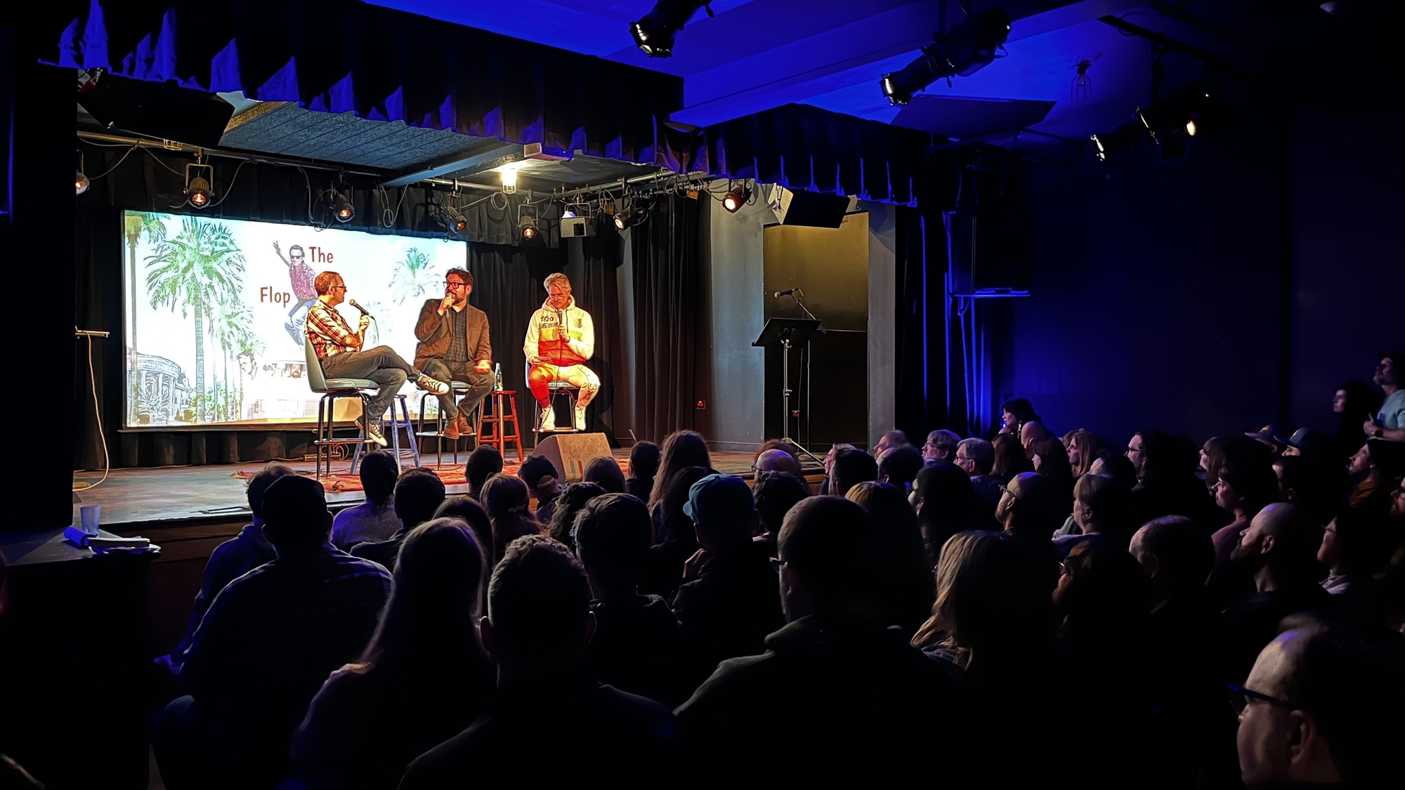 Dan McCoy, Stuart Wellington, and Elliott Kalan on stage